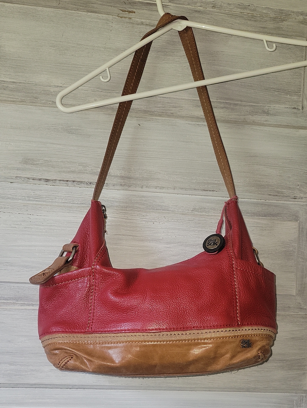 The Sak Kendra Red Pebbled Leather Hobo Shoulder Bag with Tan Trim Vintage